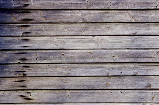 Wooden plank wall closeup detail background. Rural architecture.