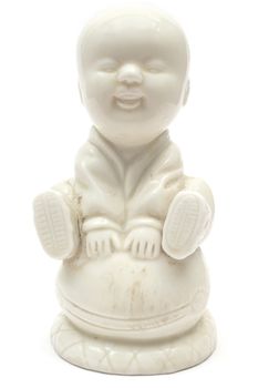 Antique Buddha statue isolated on white.