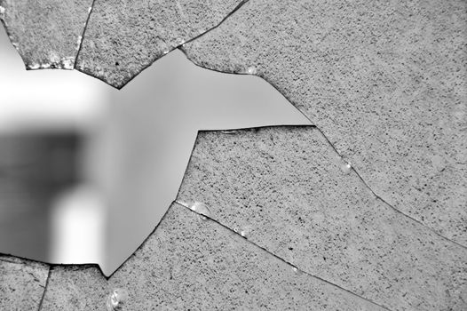 Broken glass window cracked surface texture. Black and white.