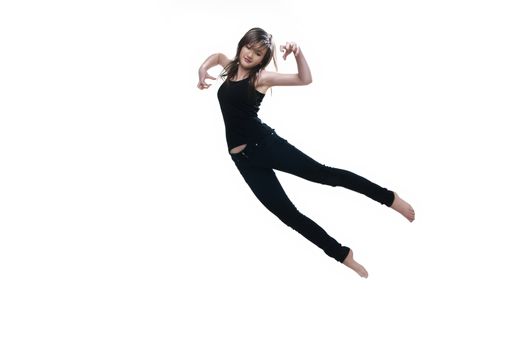 girl dressed in black jumping on white background