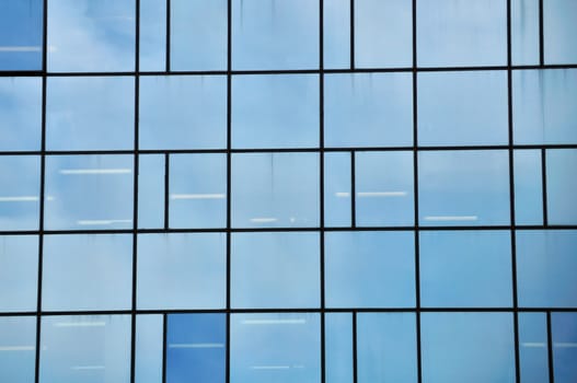 Facade of a modern glass building. Architectural detail.