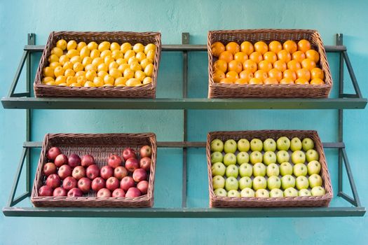 Baskets full of fruits for sale.