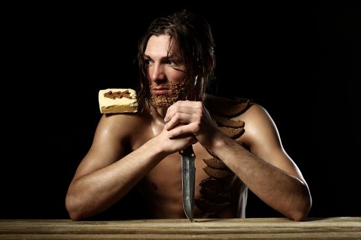 Art photo of young man with beard of bread isolated over black background