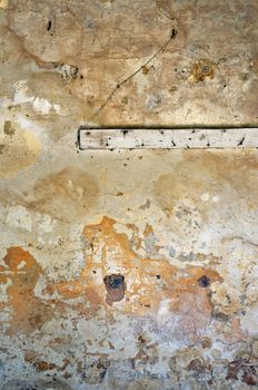 �oldy crumbling wall texture. Abandoned house interior.