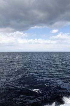 Passing through the storm. Restless deep sea water and clear coast ahead.