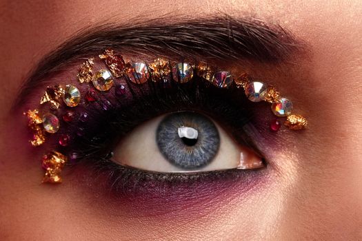 Closeup image of eye with fantasy makeup