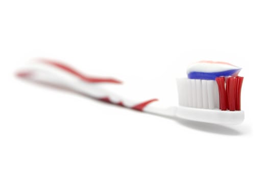 Toothbrush isolated on white. Shallow depth of field.