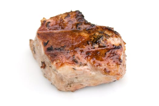 Mouth-watering piece of grilled meat isolated on a white background.