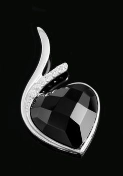 Isolated on black background, luxury white gold brooch