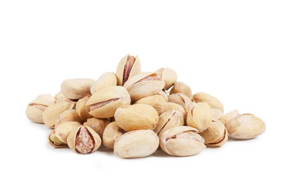 A heap of pistachios over white background