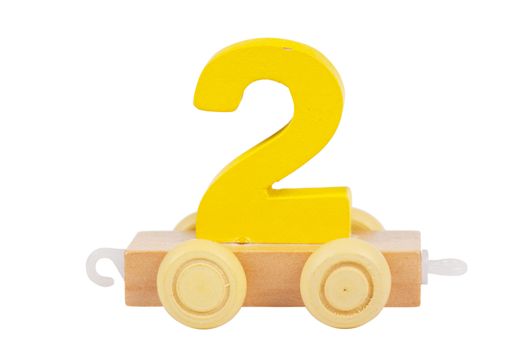 Wooden toy on a wheels number 2 isolated over white