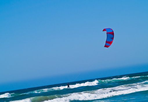 Kite Surfer out on the Ocean on a Sunny Day