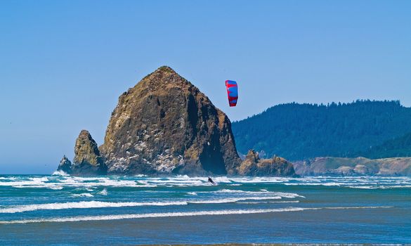 Kite Surfer out on the Ocean on a Sunny Day at Haystack Rock