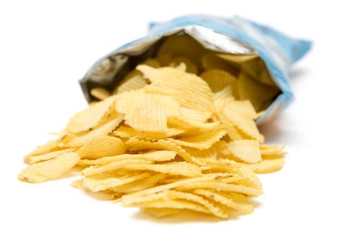 Bag of golden chips isolated on a white background.