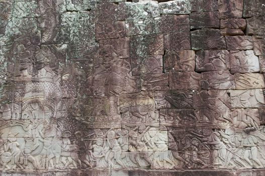an ancient rilievo in Bayon temple , Cambodia