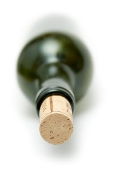 Lying wine botte. Shallow depth of field. Isolated on a white background.