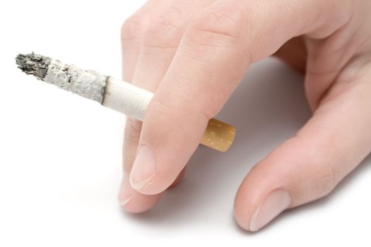 Holding a cigarette. Isolated on a white background.
