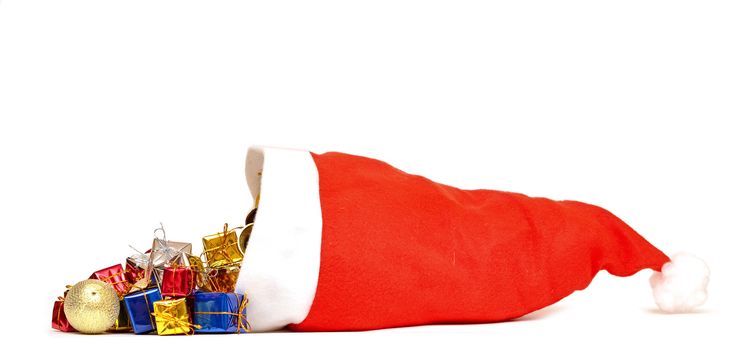 Santa Claus hat with Christmas presents on white