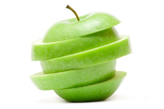 Sliced green apple isolated on a white background.