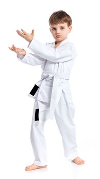 Aikido boy fighting position in white kimono isolated on white