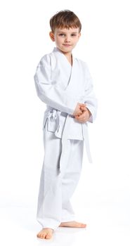 Aikido boy fighting position in white kimono isolated on white