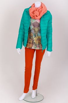 Mannequin dressed with a shirt, jeans and fashion jacket
