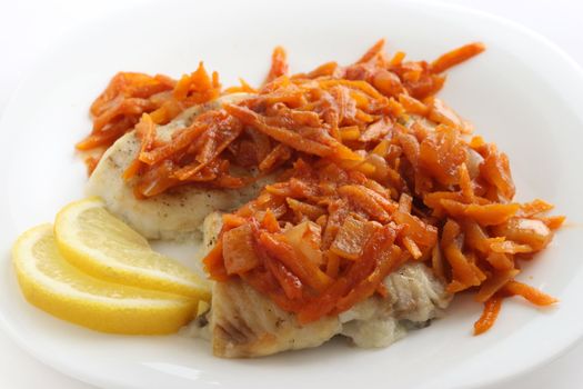 fish with fried carrot and lemon