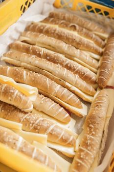 Salt sticks in a basket filled with cheese