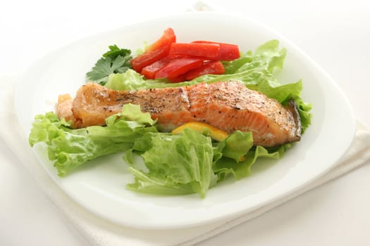 fried salmon with salad