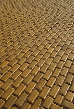 Yellow ceramic town pavement close-up and perspective