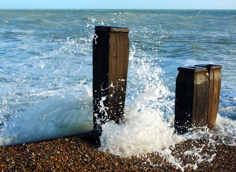 Waves breaking over beach