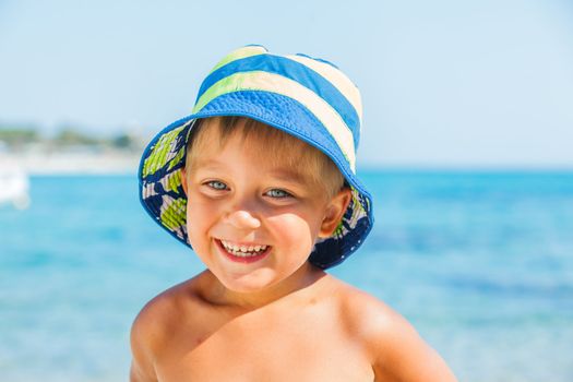 People series: portarit of boy on summer sea beach