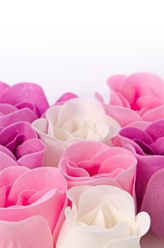 Pink, purple and white beautiful luxury soap roses background.