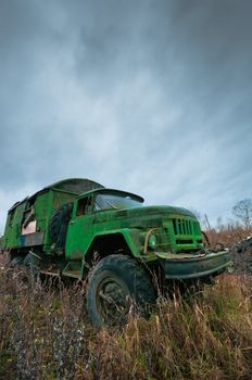 Old destroyed truck abandoned on the empty valley