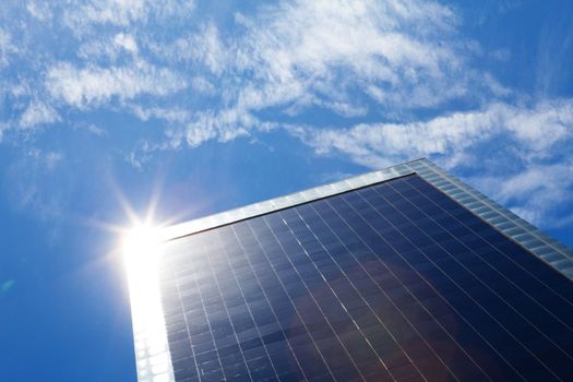 business building and blue sky with sunbeams