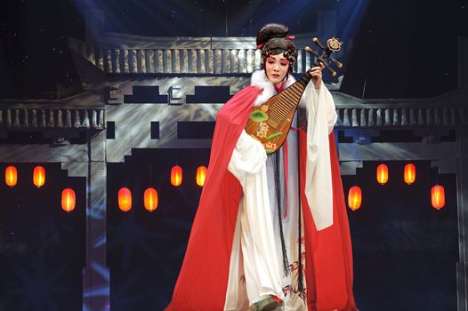 CHENGDU - JUN 4: chinese Sichuan opera performer make a show on stage to compete for awards in 25th Chinese Drama Plum Blossom Award competition at Xinan theater.Jun 4, 2011 in Chengdu, China. 