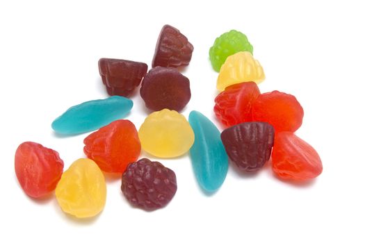 Colorful fruits candy closeup on white background 
