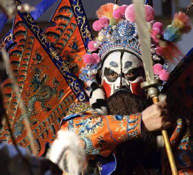 china opera actor with theatrical costume and facial painting
