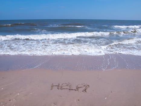 Help drawn on the sand in tropical beach