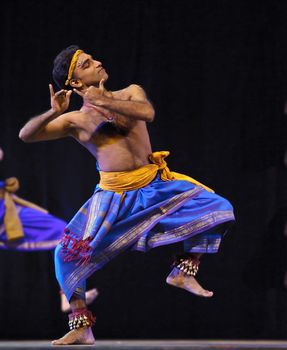 CHENGDU - OCT 24: Indian dancer performs folk dance onstage at JINCHENG theater during the festival of India in china on Oct 24,2010 in Chengdu, China.