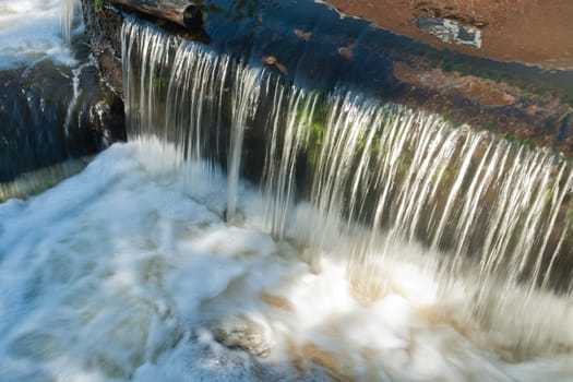 Beautiful cascading waterfall over rocks perfect nature background image