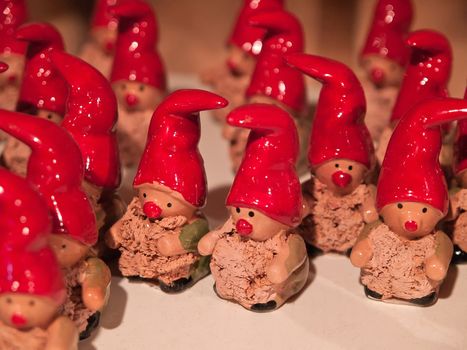 Classical Christmas Elf dwarf gnome porcelain figurines on display in a shop