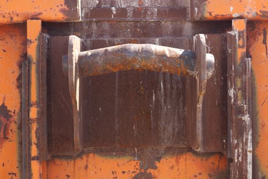 end of dumpster lfting bracket abstract background