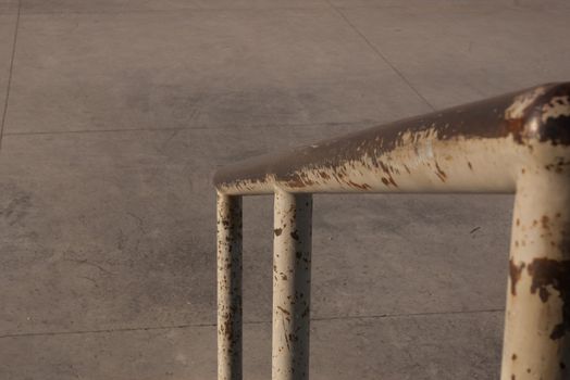 worn skateboarding rail at skate park used for rail sliding