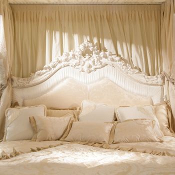 White bedroom with soft light for this romantic picture