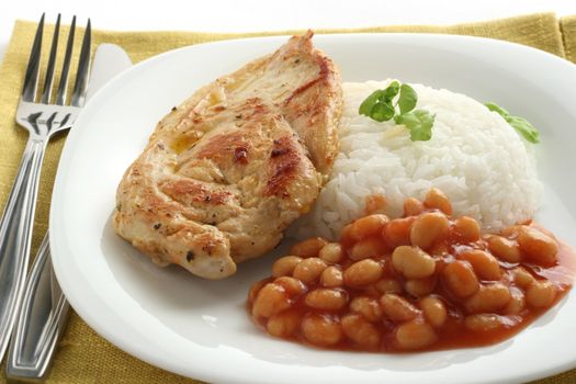 fried chicken with boiled rice and beans