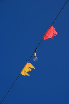 flags and lamp on sky background