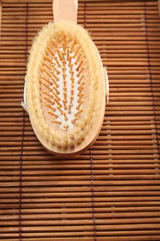 close up of the hair brush on the bamboo mat