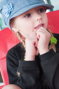 Portrait of little girl in denim hat