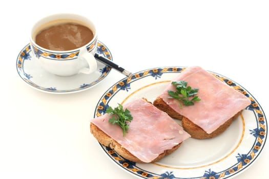 toasts with ham and a cup of coffee